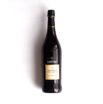 A bottle of Lustau sherry over a white background.