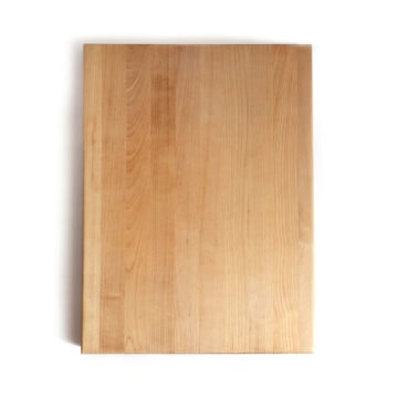 Top down view of a large wood cutting board.