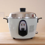 10-cup Tatung multicooker on a wood cutting board.
